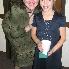 Morgan's mom posing with a smaller family friend
