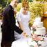 Reception -- cutting of the cake, first pose